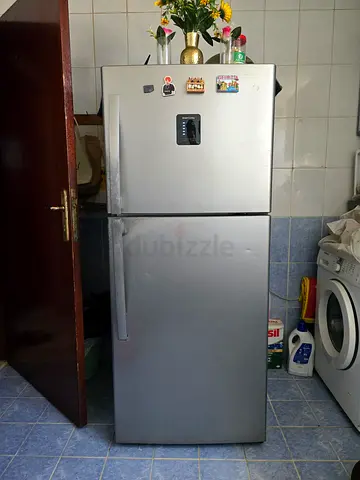 Used silver double-door fridge in good working condition