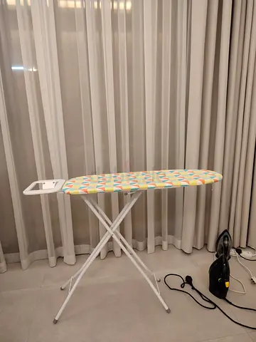 Used ironing board with cover - foldable, good condition