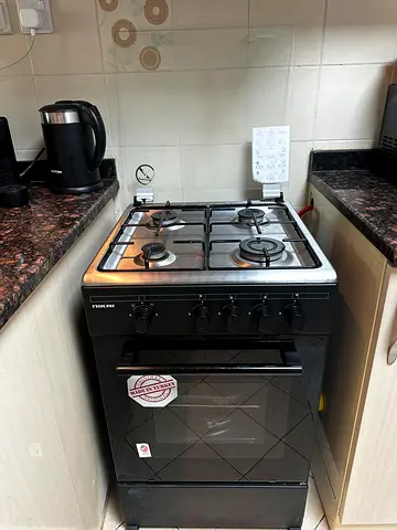 Used 4-Burner Gas Stove with Oven - Good Working Condition
