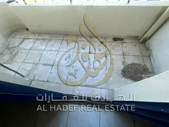 2BR in Al Shuwaiheen, company contract. Balcony with open view, split AC, central gas, near services