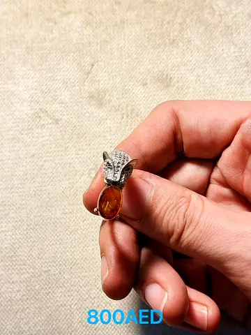 Silver panther ring with amber stone - size adjustable, good condition