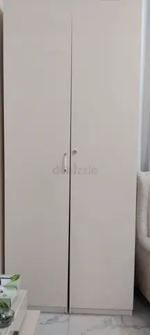 Tall white two-door wardrobe / storage cabinet - good condition
