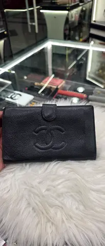 Black Quilted Leather Wallet with Fold-Over Snap Closure