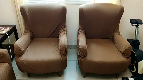 Pair of Wingback Armchairs with Brown Covers with sofa 4 seater with brown cover.