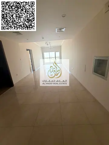 For annual rent in Al Bustan, opposite the prayer hall (Musalla)—a prime location featuring excellent apartments. Units include a bedroom, a living ro