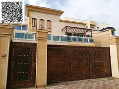 For sale: Luxury villa in Al Muwaihat 3, stone facade, consisting of 5 master bedrooms, a majlis, a 