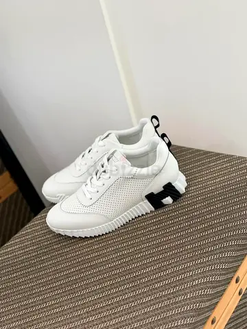 Hermes White perforated low-top sneakers with black heel detail, size available