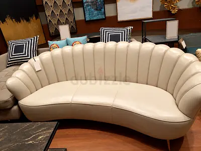 Last minute sale! Brand-new, never-used off-white curved shell-back leather 3-seater sofa bed