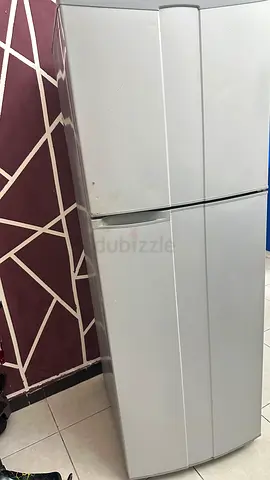 White double-door refrigerator with top freezer - used