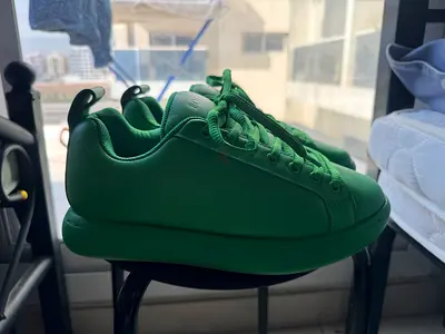 Green platform sneakers, gently used, size not specified