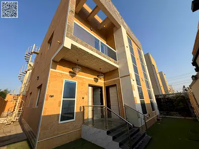 Villa for rent in Al Yasmin, brand new, second occupancy, five master bedrooms, majlis, two living rooms, kitchenette, and carport behind the park, for 95,000 (negotiable).