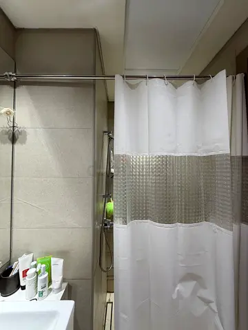 Used white shower curtain with clear middle panel and stainless steel rod