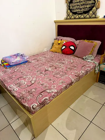 Queen bed with storage and upholstered headboard - good condition