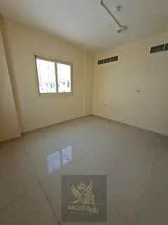 Two-bedroom apartment with a living room and central air conditioning for rent in Al Musalla at a sp