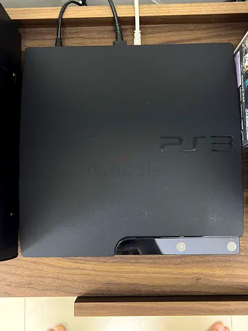 Sony PlayStation 3 Slim console - good working condition with 3 controllers and 2 games and cables