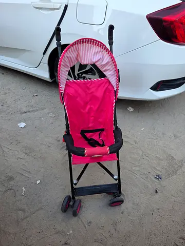 Lightweight pink umbrella stroller - good condition