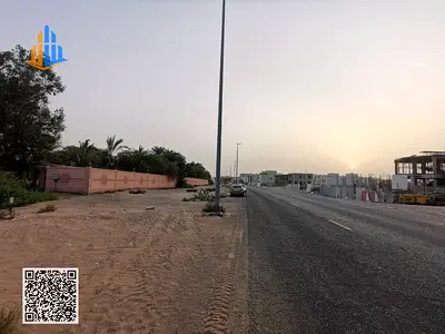 Townhouse plot for sale in Ajman, Al Helio 1 area, price AED 375,000, freehold for all nationalities.
