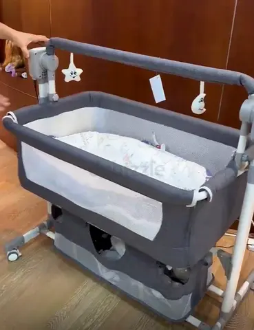Gray Baby Bassinet/Cradle with Storage and Toys - Good Condition