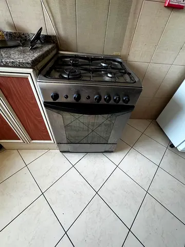 Used freestanding gas stove - 4 burners, stainless look