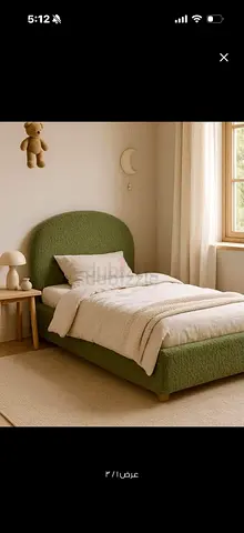 Single green upholstered bed with curved headboard - good condition