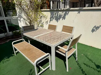 Outdoor dining table set with 4 chairs and bench - teak slats, white frame, cushions