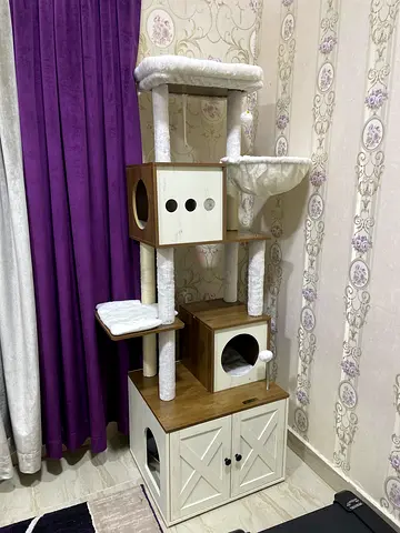 Large multi-level wooden cat tree with condo and scratching posts and litter space