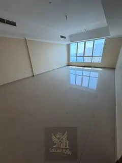 For rent in Al Majaz 2, a spacious apartment with a panoramic view of Sharjah. 2 bedrooms, hall, mai