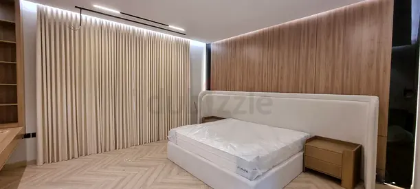 Modern king-size bed with bedside tables