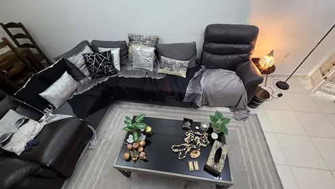 L-shaped IKEA living room dark grey sofa set with 9 decorative cushions