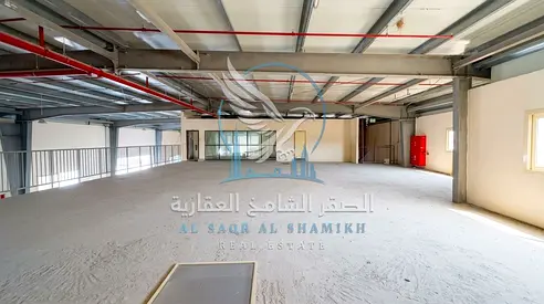 Factory for rent in Sajaa Al Jalil, 55,000 sq ft, 30,000 sq ft warehouse, 10 labour rooms, 10 bathrooms, weighing scale, office and Civil Defense.