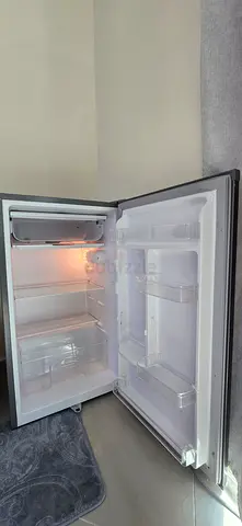 Single-door upright freezer / refrigerator in stainless finish - good condition