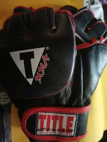Used TITLE brand MMA training gloves, size medium