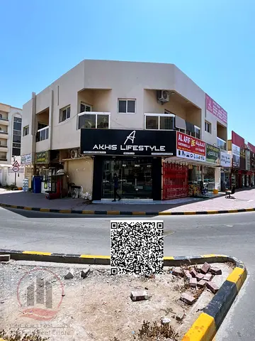 Building for sale in Al Nuaimiya, Ajman. Prime location, corner plot on two streets, residential/commercial.