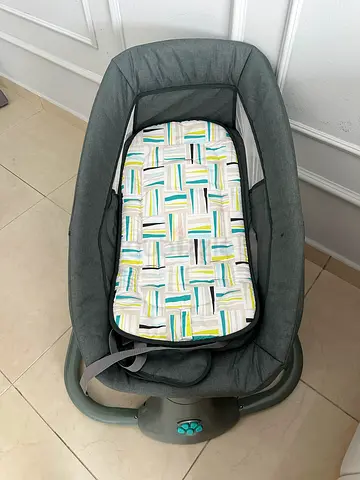 Gray baby swing with music and vibration controls - good condition