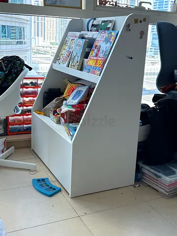 White multi-shelf toy/book display unit with storage - good condition