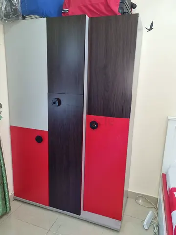Two-door Wardrobe / Armoire in Dark Wood with Red Panels - Good Condition