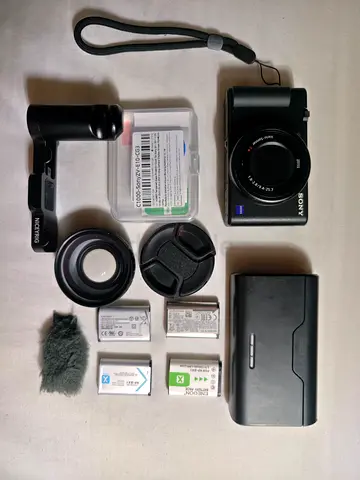 Sony ZV Mark 1 compact camera with accessories — extra batteries, case, grip, Screen Guard
