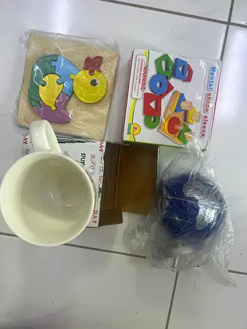 Mixed baby and toddler toys bundle — shape sorter, wooden puzzles and more
