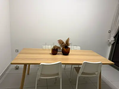 Wooden dining table with 5 white chairs - simple modern set