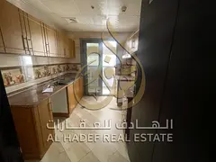 Al Majaz 3; we present a distinct 1-bedroom and hall apartment (second occupant) featuring a balcony