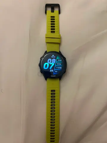 Garmin forerunner 970 GPS Sports Smartwatch with Yellow Strap and black extra strap