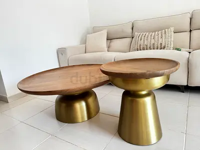 Pair of Marina Home modern brass base solid wood top coffee table and end table, bought at 3850 AED
