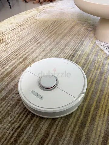 Used white robot vacuum cleaner - good condition