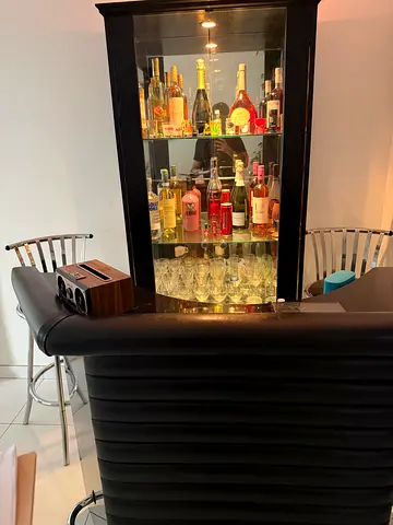 Wooden black bar with bar chairs