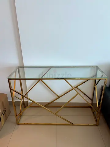 Gold metal console table with glass top - modern design