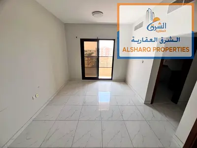 One-bedroom apartment with a living room in Al Rawda 1, near Kenz Mall and the police station. Features include two bathrooms (including a master bedr