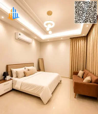A fully furnished villa in Al Helio 2, Ajman, offering space, privacy, and comfort, with a rooftop and a small garden with an outdoor seating area.
