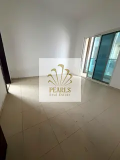 Premium 2BR + living room in City Tower, Al Nuaimiya 2. 2 baths, 2 balconies, closed kitchen, centra