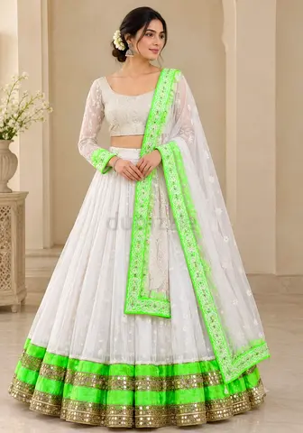 Navratri Chaniya choli in white and florescent green colour with lots of embroidery and sequence wor