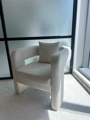 Modern boucle accent armchair in off-white, gently used. 4 identical chairs are available